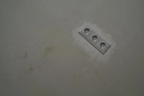 Power socket in the wall. electrical outlet close up. repair process Foto stock
