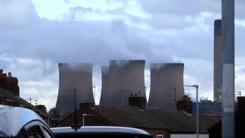Power station brick cooling chimney stacks smoking above residential Video stock 118220149