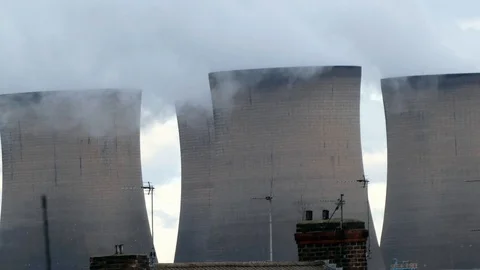 Power station brick cooling chimney stacks smoking above residential Video stock 118220201