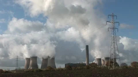 Power station - chimneys pumping smoke into atmosphere Stock Footage