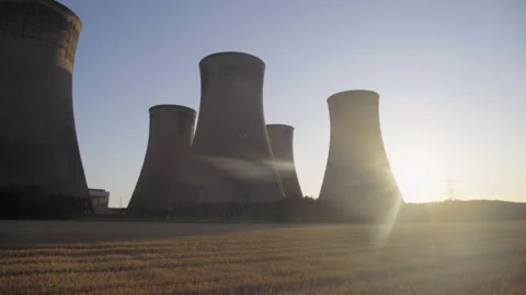Power Station Cooling Towers Against Setting Sun Stock Footage 242515855