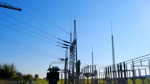 Power station in the rays of the bright sun on a blue sky background. Stock Footage 194415836
