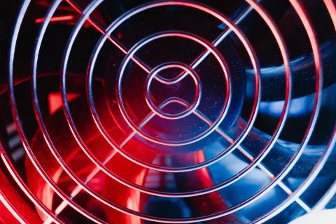 Power supply cooler Electronics technology concept details blue red light bac Stock Photos