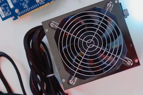 Power supply Electronics technology concept white background details blue red Stock Photos