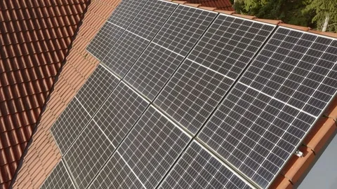 The power supply system from solar modules on the tiled roof of a private house. Stock Footage 255321208