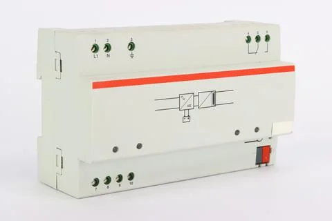 A power supply unit on a din rail for powering the automation bus. Stock Photos