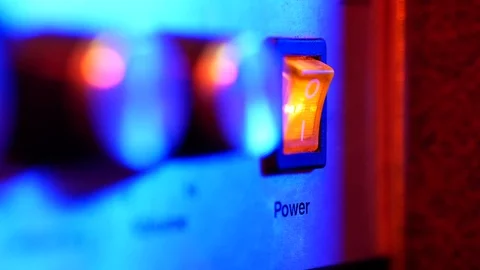 A power switch being turned on and off by woman Stock Footage 70703954