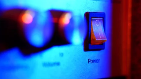 A power switch being turned on and off by man Stock Footage 70731182