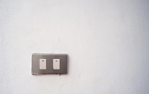 Power switch on white wall Foto stock