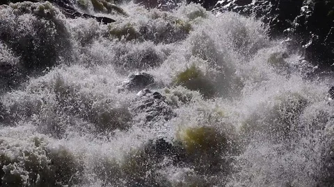 Power of the swoolen mountain river in the rocky environment. Video stock 128268133