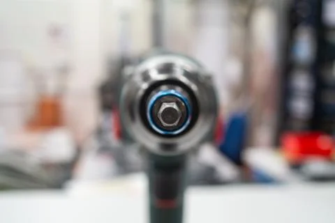Power tool drill screw head macro close up shot in a lab isolated against bri Stock-Fotos