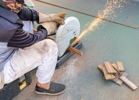 The power tool generates a dramatic stream of bright orange sparks Stock Photos