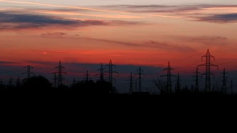 Power towers at sunset Stockbeeldmateriaal 76442082