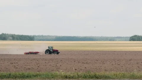 Power tractor with multi function unit performs the plowing, cultivating and Stock Footage 116589950