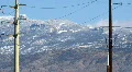 Power transmission and snowy mountains - 1 pan tilt HD Footage