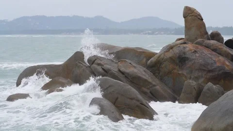 Power of waves breaking over rocks Stock Footage 148608933