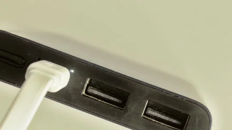 The powerbank is charging, close up.The charge indicator flashes Video stock 253679570