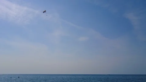 Powerboat pulls a parachute in the sky Stock Footage 94624288