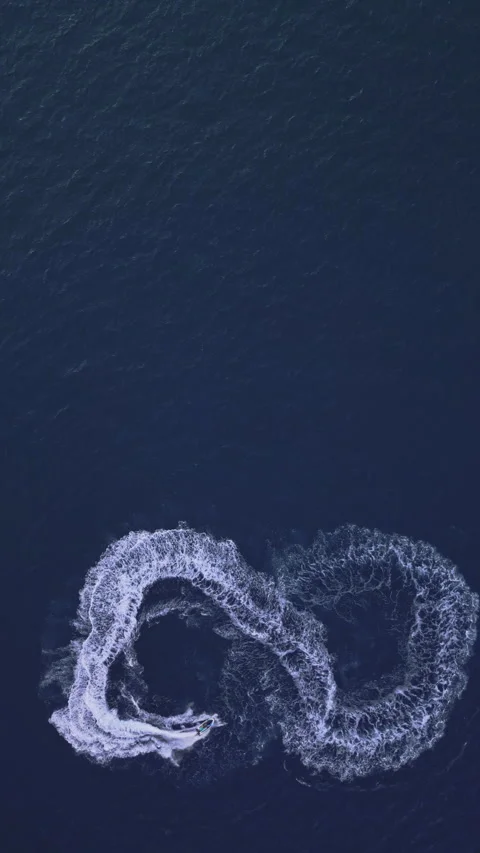 Powerboat turns loop number eight on the sea making infinity future concept Stock Footage 283562869