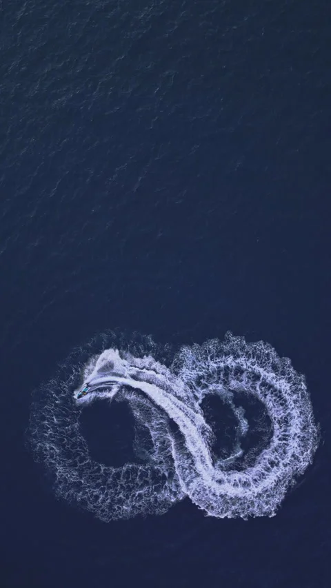 Powerboat turns loop number eight on the sea making infinity future concept Stock Footage 283563237