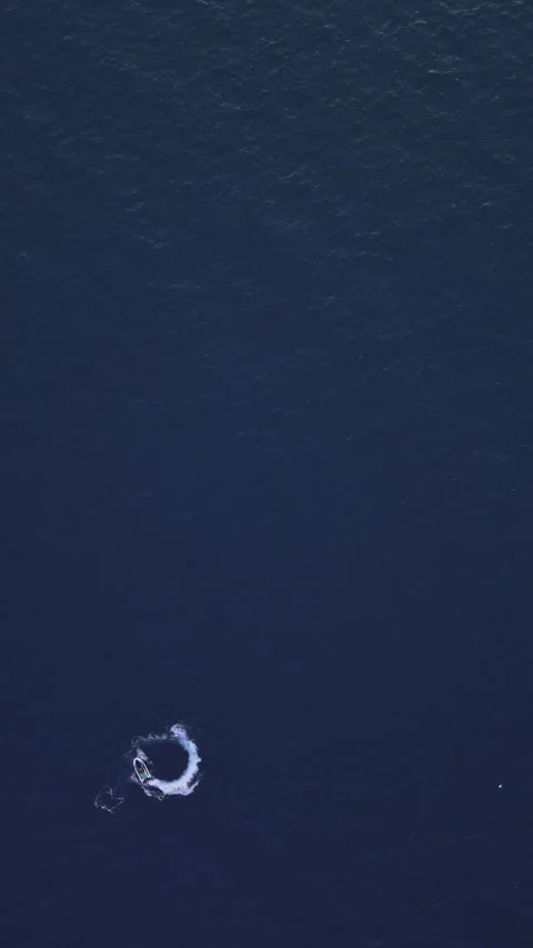 Powerboat turns loop number eight on the sea making infinity future concept Stock Footage 283563888