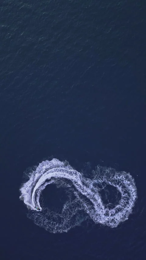 Powerboat turns loop number eight on the sea making infinity future concept Stock Footage 283564143