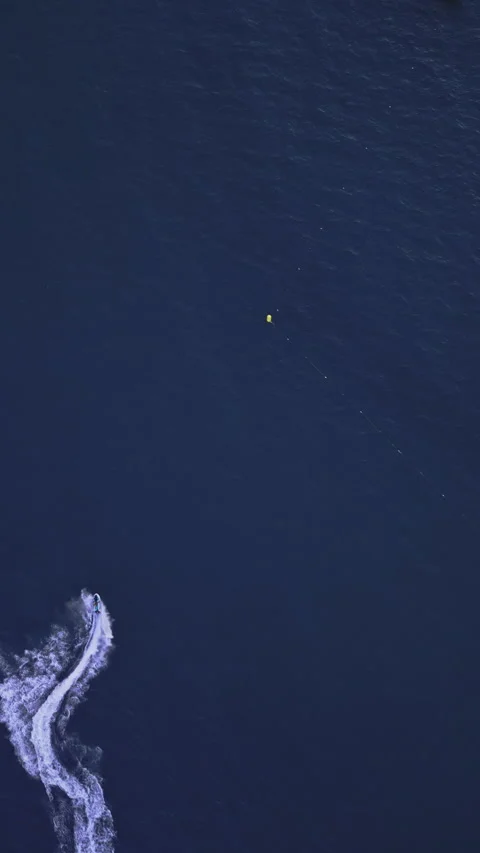 Powerboat turns loop number eight on the sea making infinity future concept Stock Footage 283564242