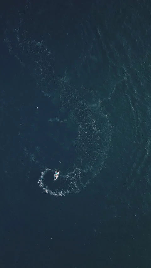 Powerboat turns loop number eight on the sea making infinity future concept Stock Footage 283564306