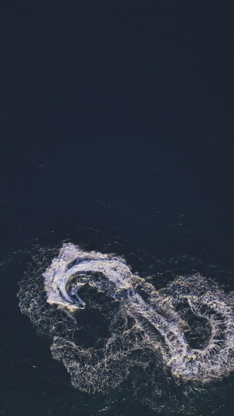 Powerboat turns loop number eight on the sea making infinity future concept Stock Footage 283564474