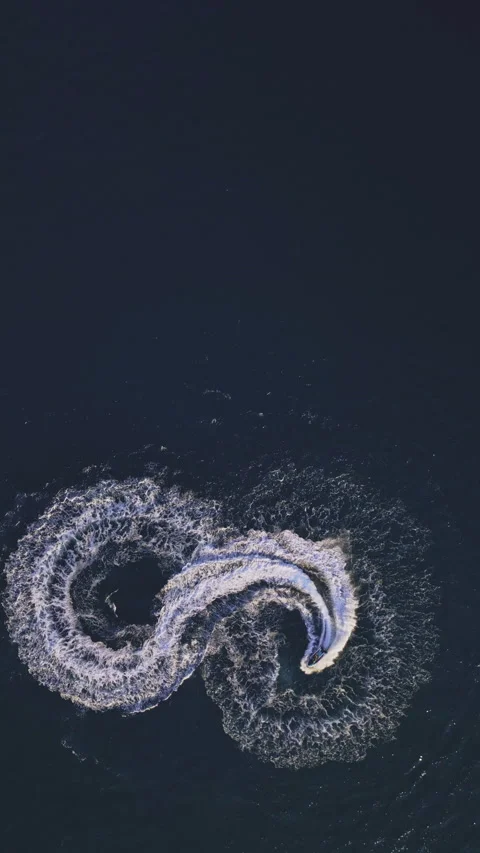 Powerboat turns loop number eight on the sea making infinity future concept Stock Footage 283566963