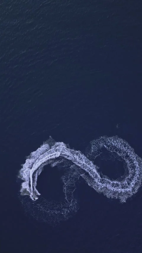 Powerboat turns loop number eight on the sea making infinity future concept Stock Footage 283567628