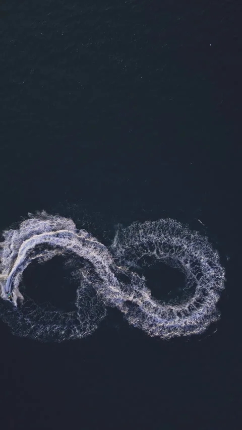 Powerboat turns loop number eight on the sea making infinity future concept Stock Footage 283567829