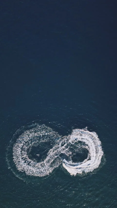 Powerboat turns loop number eight on the sea making infinity future concept Stock Footage 283568273