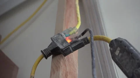 Powered extension cord with light indicator at construction site 스톡 동영상 313643096