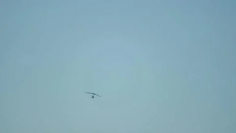 Powered para glider in the blue sky Stock Footage 143234259