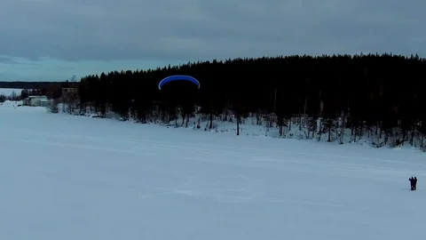 A powered paraglider flies in the face of Stock Footage 88289549