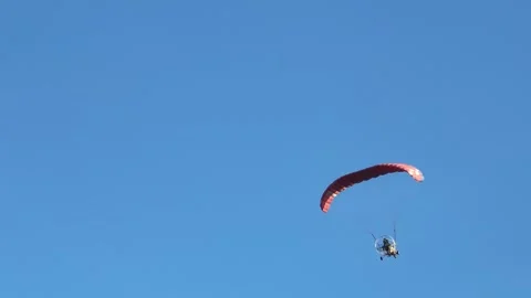 Powered Paraglider Flying In Clear Blue Sky Stock Footage 313065188