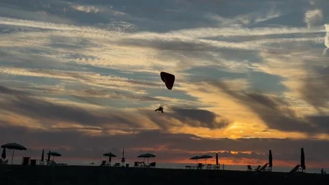 Powered Paraglider Flying Over Sea Sunset Video stock 342320139