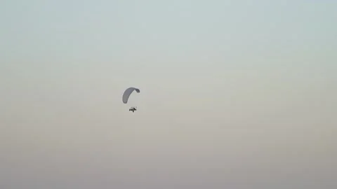 Powered Paraglider Soaring High In The Sky In Dubai, United Arab Emirates Stock Footage 136815589