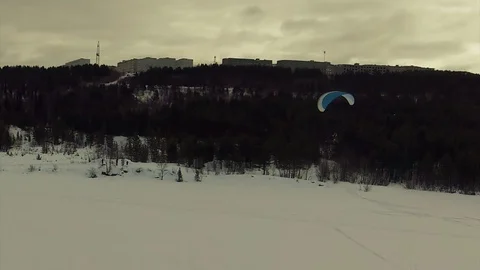 A powered paraglider turns to the left Stock Footage 88333277