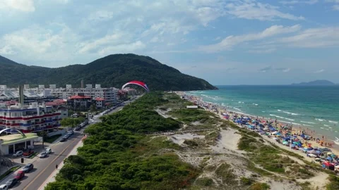 Powered Paragliding Over Crowded Praia dos Ingleses, Florianopolis Brazil Stock Footage 331001397
