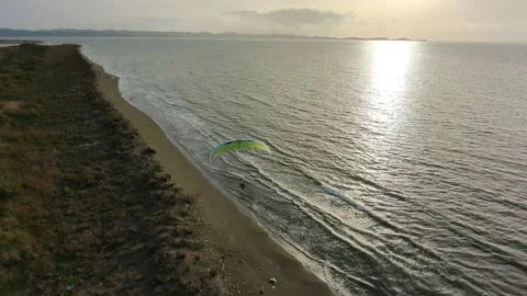 Powered paragliding paramotor flying over Albanian coast mountains and beaches 動画素材 333715656