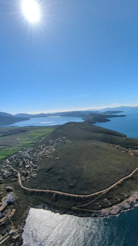 Powered paragliding paramotor flying over Albanian coast mountains and beaches Video stock 333715657