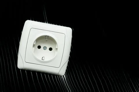 Power.Electrical plug socket for connecting devices on dark Fotos de archivo