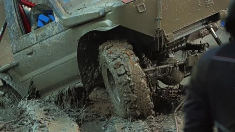 Powerful 4x4 truck navigating a difficult mud bog Stock Footage 344877156