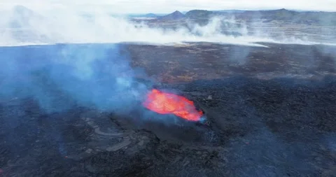 Powerful aerial drone footage capturing an active volcano eruption in Iceland, w Stock Footage 285535110
