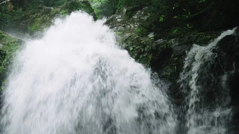 Powerful and dramatic waterfall, the water is gushing very fast down the side of 스톡 동영상 130369934