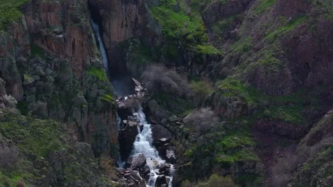 Powerful and high mountain waterfall Akkum in the south of Kazakhstan in spring Stock Footage 275342346
