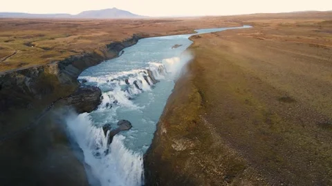 Powerful and wide Gullfoss waterfall with blue river on a sunny day Stock Footage 226576051