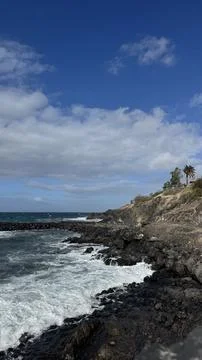 Powerful Atlantic Ocean waves crash against the volcanic rocky shoreline on T Stock-Fotos